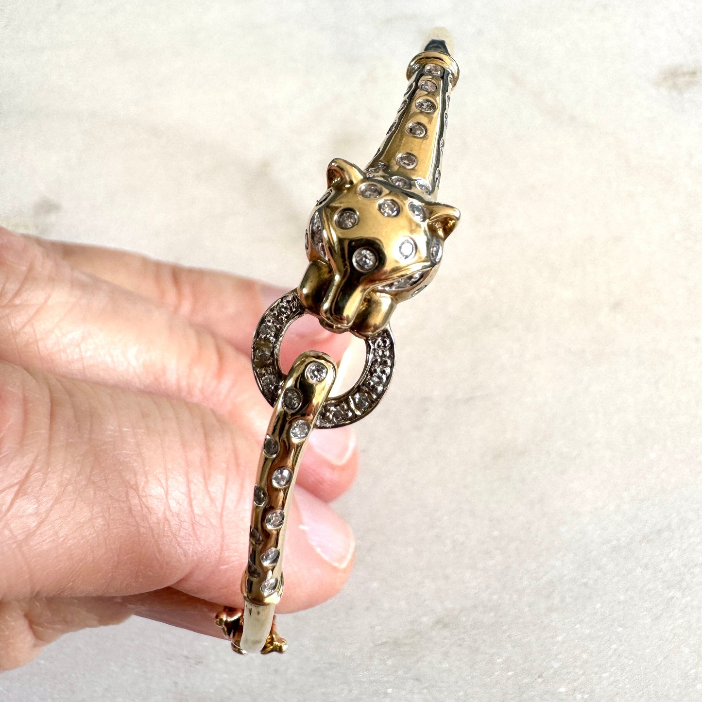 SHOW STOPPER! 9ct gold and diamond hinged panther bangle