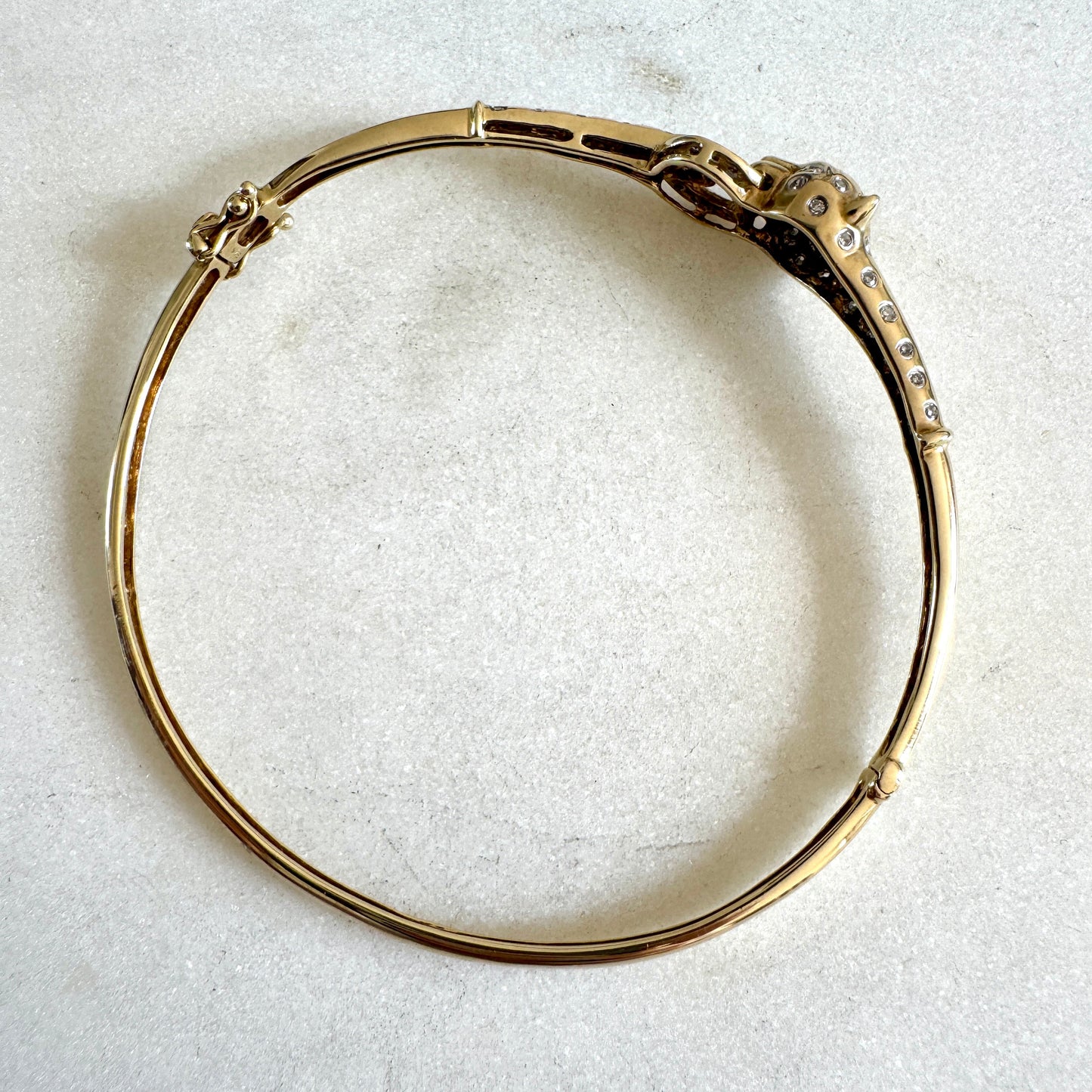 SHOW STOPPER! 9ct gold and diamond hinged panther bangle