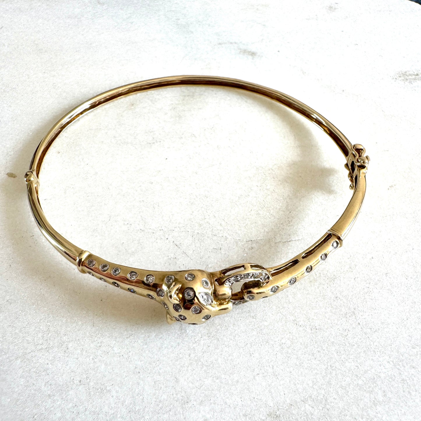 SHOW STOPPER! 9ct gold and diamond hinged panther bangle