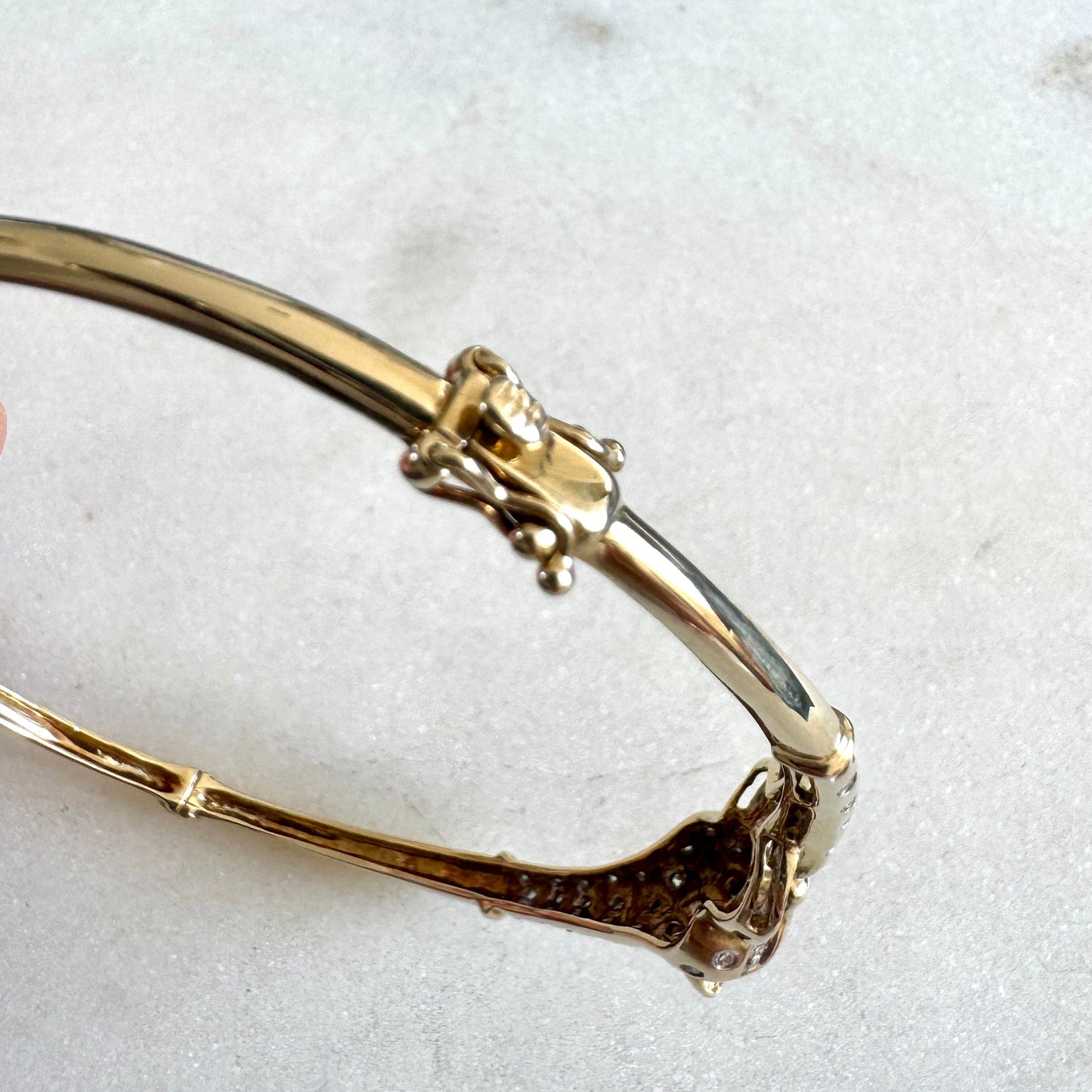 SHOW STOPPER! 9ct gold and diamond hinged panther bangle
