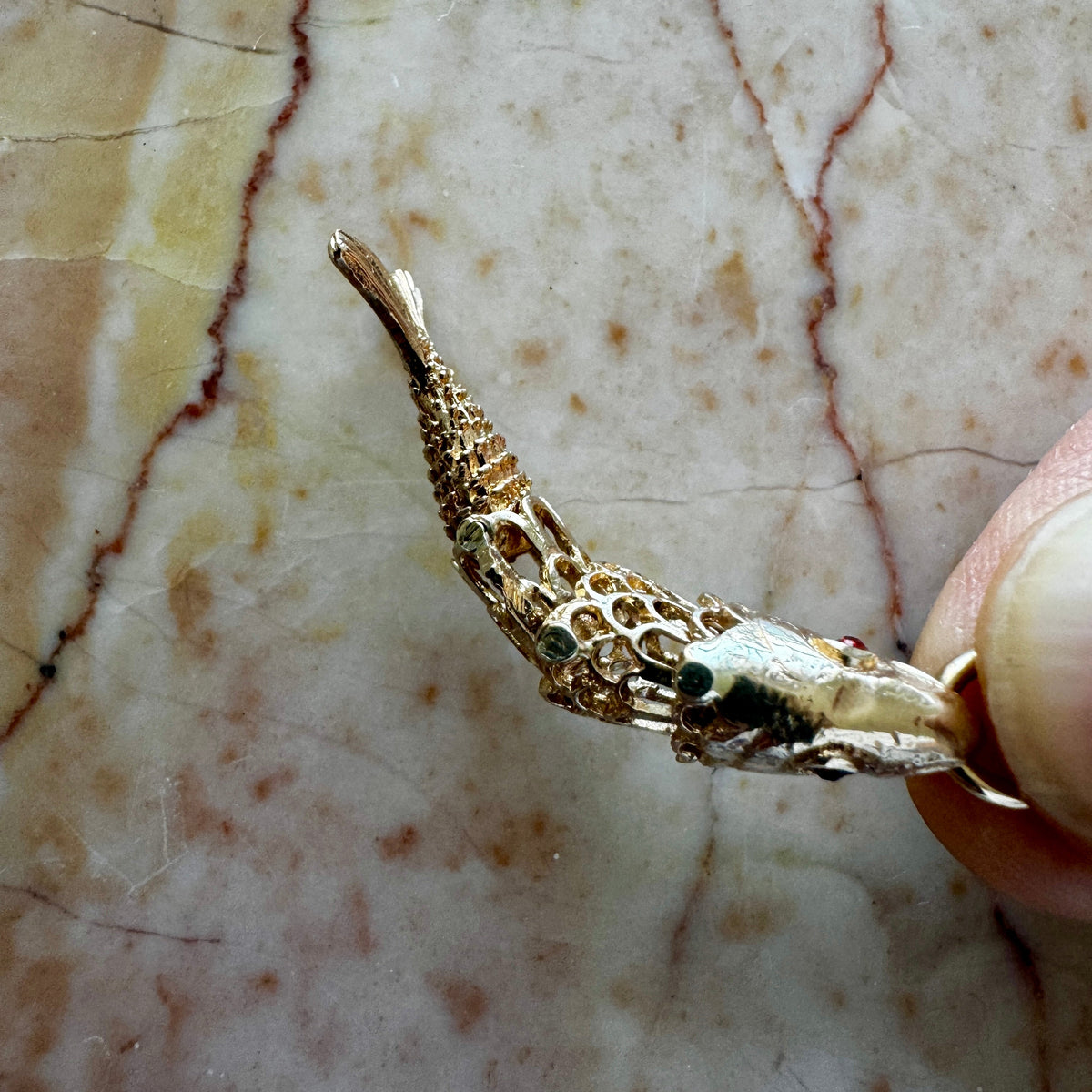 9ct 'old gold' articulated fish - full British hallmarks with garnet eyes! Collectable!